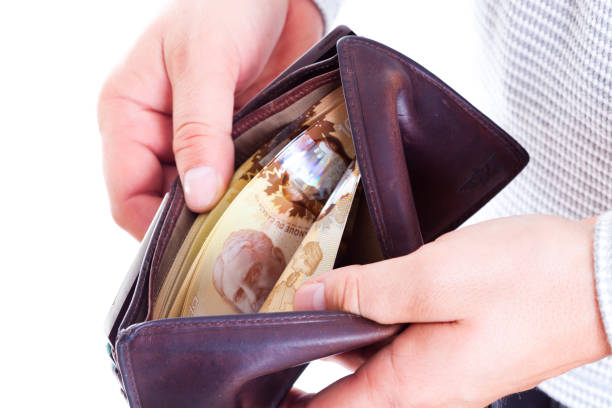 man counting money in his wallet - wallet buying white dollar imagens e fotografias de stock