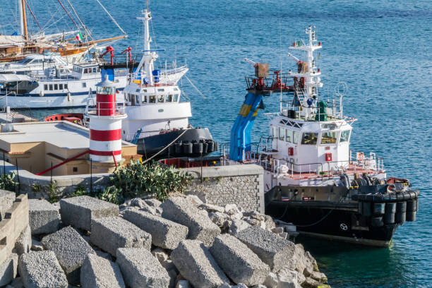Tugboats moored at the breakwater stock photo