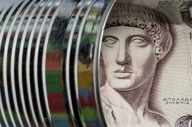 istock Greek paper currency (Drachma) stored in a tin can 687228074