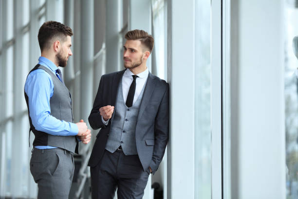 istock Two business colleagues at meeting in modern office interior. 687232392