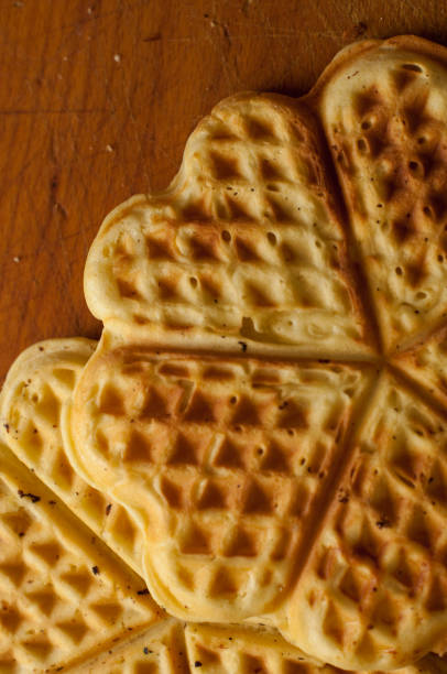 istock waffles on a wooden background 687235110
