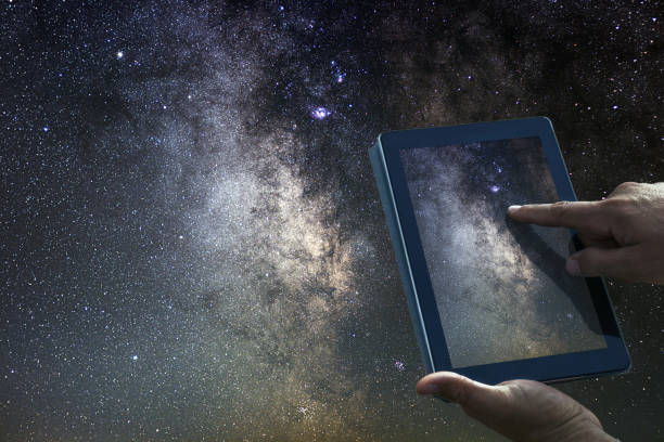 istock Space Astronomy Exploration Concept. Night Sky tablet Milky Way Galaxy. 687254214