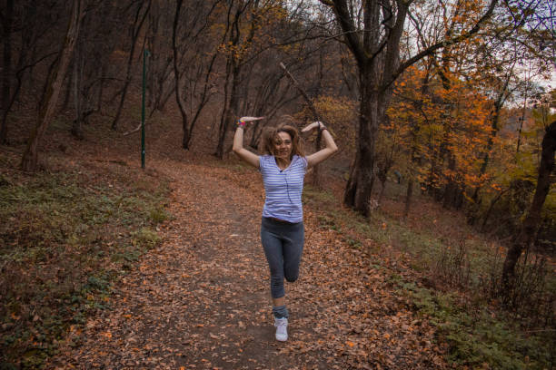 istock Girl exercising in a park 687261526