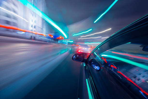 istock View from Side of Car moving in a night city 687261696