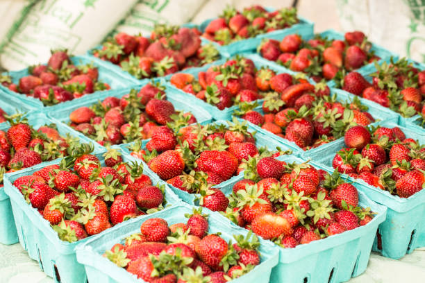 Strawberries In Baskets At Farmers Market stock photo