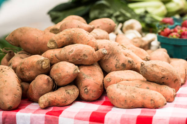 Sweet Potatoes On Table At Farmers Market stock photo