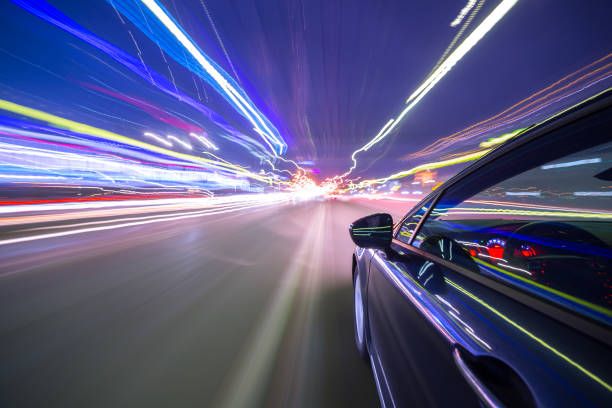 istock View from Side of Car moving in a night city 687280806
