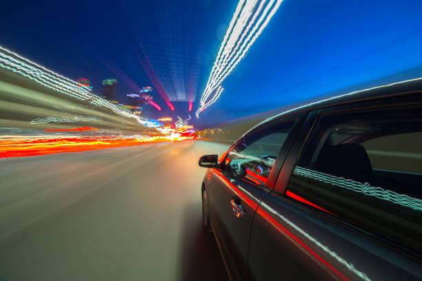 istock View from Side of Car moving in a night city 687280876