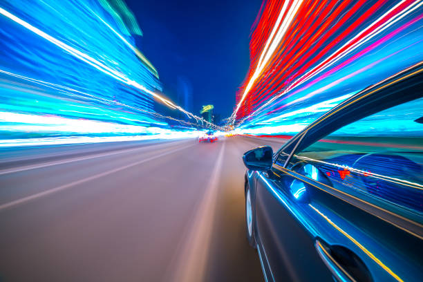 istock View from Side of Car moving in a night city 687283006