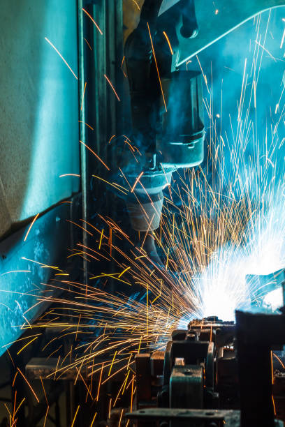 istock Welding robots movement in a car factory, 687306590