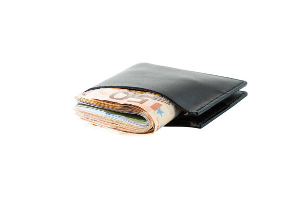 istock Money dollars in a brown leather purse side view isolated on white background 687308904