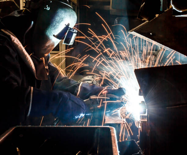 istock Industrial Worker at the factory welding 687308970