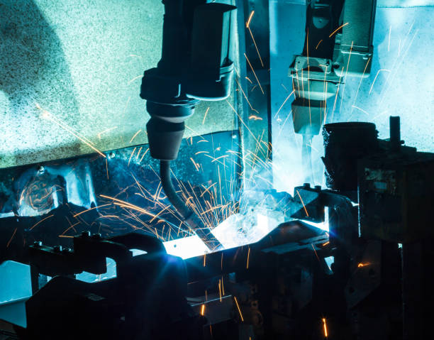 istock Welding robots movement in a car factory, 687309014