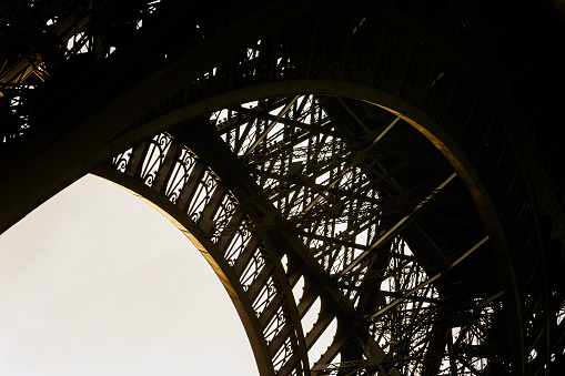 Detail of Eiffel Tower Paris showing intricate iron work detail