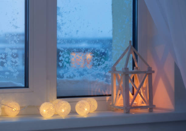 istock winter decor with candles and garland 687313042