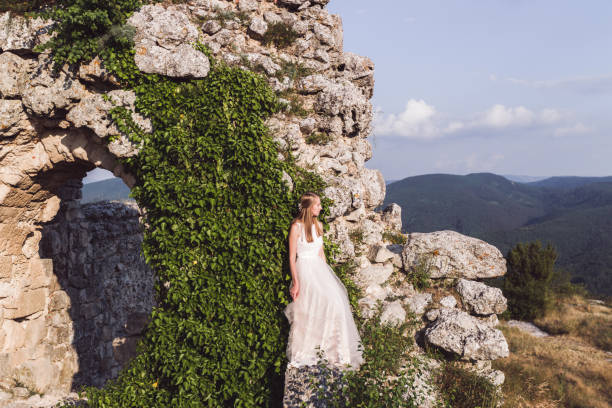 Bride potrait on stone background of the old fortress