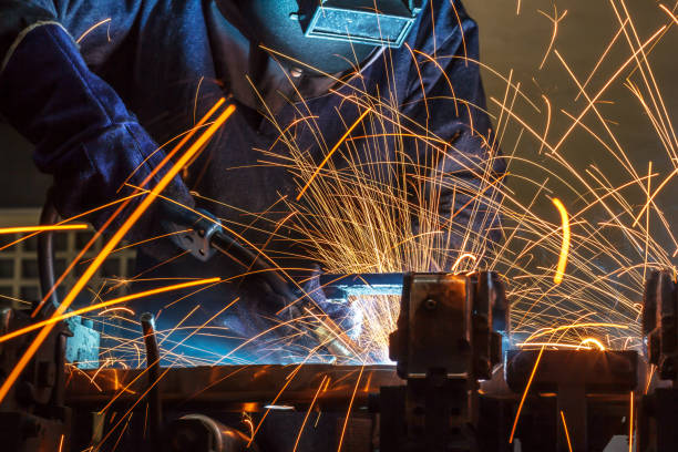 istock Worker welding the steel part by manua 687319130