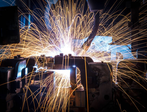 istock Welding robots movement in a car factory 687319402
