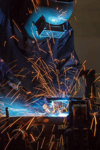 istock Worker welding the steel part by manua 687324328