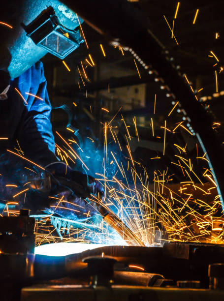 istock Worker welding the steel part by manua 687325060