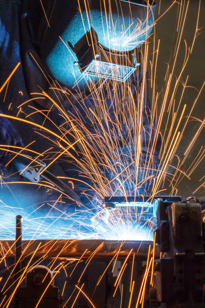 istock Worker welding the steel part by manua 687325252