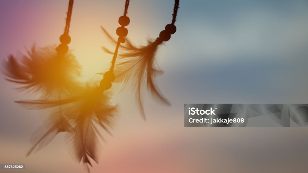 Abstract dream catcher background Dream catcher silhouette in the rising sun with blurred focus for background Spirituality Stock Photo