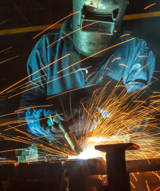 istock Worker welding the steel part by manua 687325610