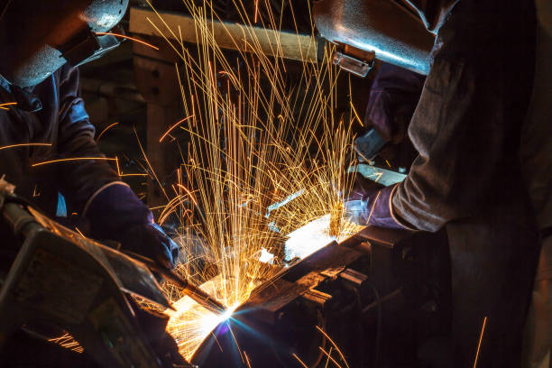 istock Worker welding the steel part by manua 687325914