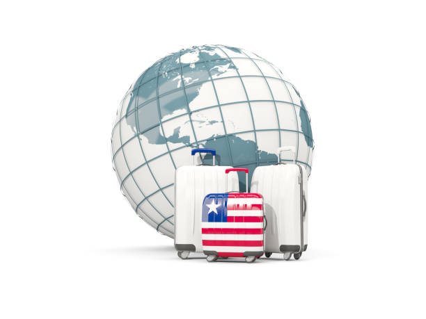 istock Luggage with flag of liberia. Three bags in front of globe 687326016