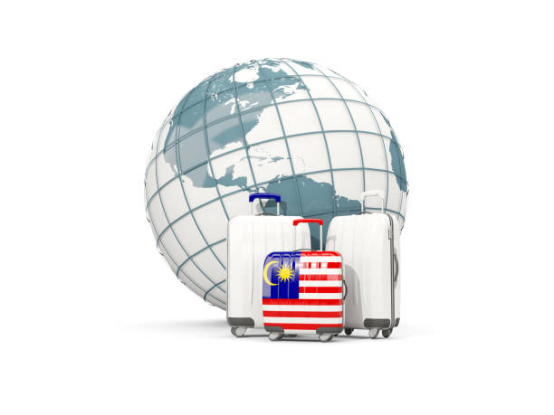 istock Luggage with flag of malaysia. Three bags in front of globe 687328292