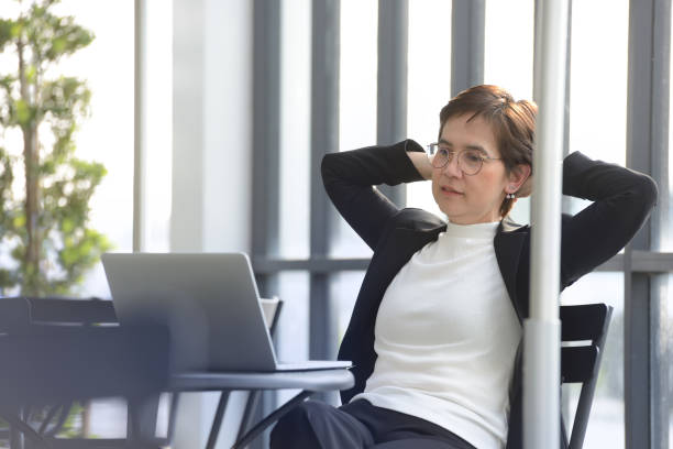 istock Executive businesswoman  working with laptop computer at outdoor cafe 687329026