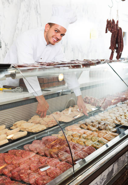 istock Young cook at butcher store 687333510