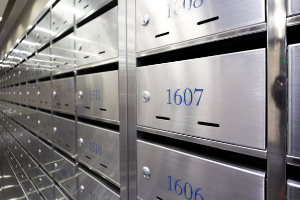 Kyiv, Ukraine - June 24, 2021: Installation of new mailboxes in the entrance of a multi-storey residential building. New mailboxes with numbers and keys in them.
