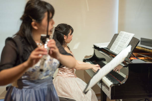 istock Flutist and Pianist playing music 687335704