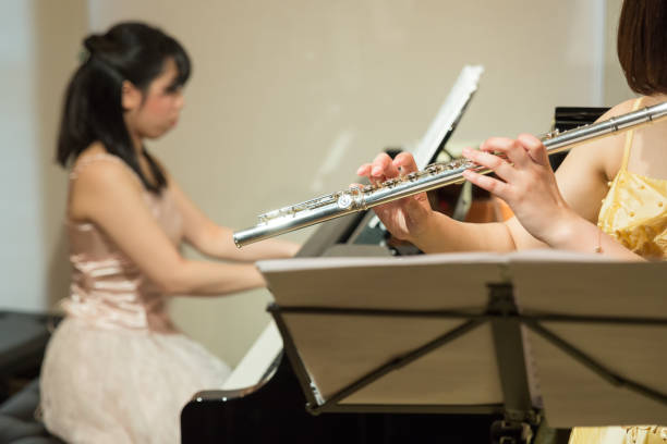 istock Flutist and Pianist playing music 687335718