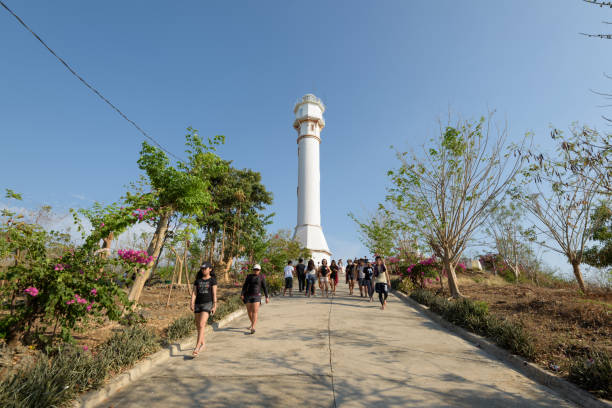 Cape Bolinao Lighthouse Pangasinan, Philippines - April 13, 2017: Visitors at  Cape Bolinao Lighthouse in Pangasinan, Philippines. pangasinan stock pictures, royalty-free photos & images