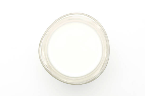 istock Glass of milk isolated on white 687343908