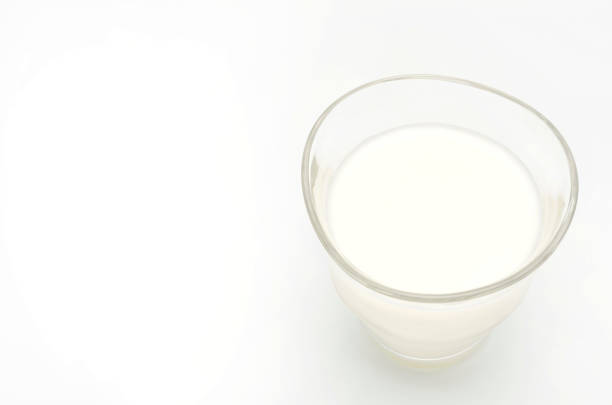 istock Glass of milk isolated on white 687343926