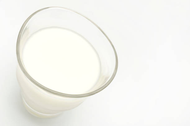 istock Glass of milk isolated on white 687343930
