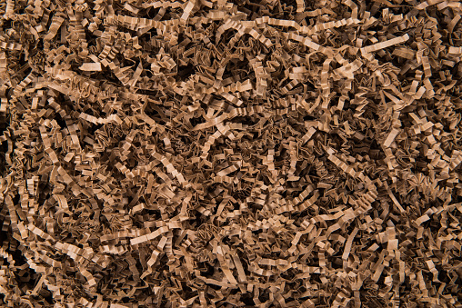 Close up of brown shredded corrugated paper packing material. Flush image.