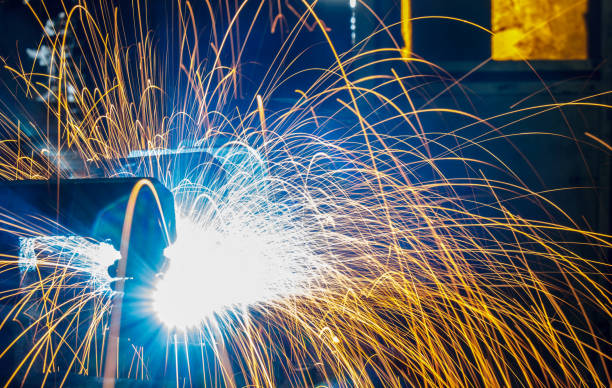 istock Welding robots movement in a car factory 687347548