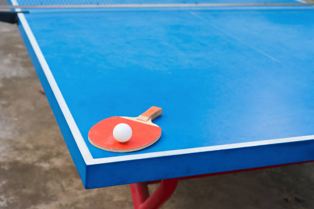 istock pingpong racket and ball on a blue pingpong table 687356328