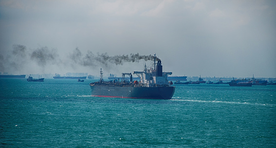 Black Smoke from Ship Sailing on the High Sea