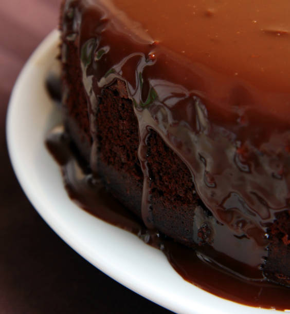 istock Super chocolate cake with liquid glaze sauce 687363400