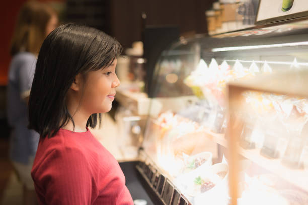 istock Asian girl choosing ice-cream 687369296