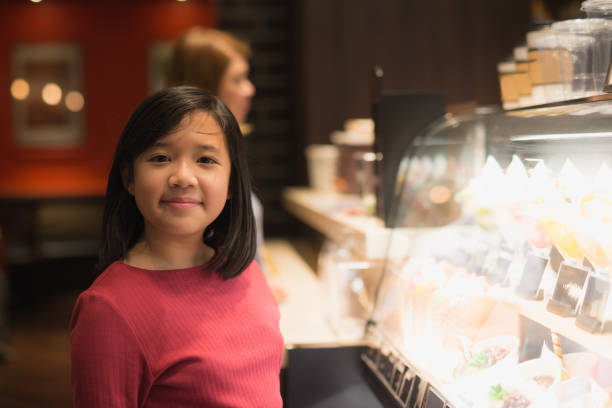 istock Asian girl choosing ice-cream 687369300