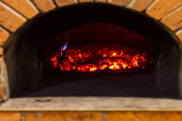 istock The fire burns in a wood pizza oven 687369326