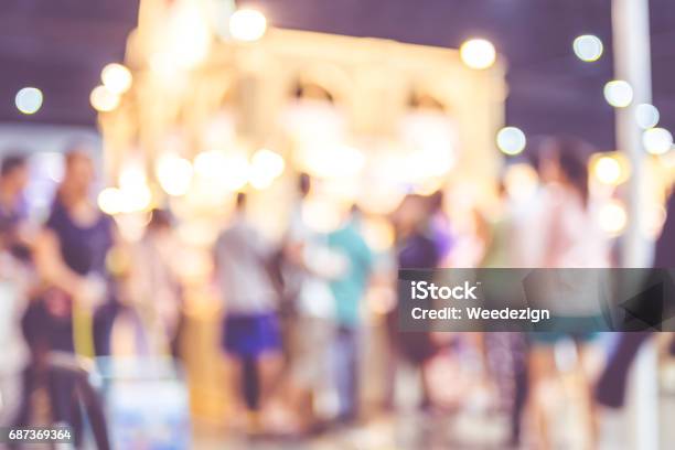 Blurred Background Crowd Of People In Expo Fair With Bokeh Light Vintage Filter Stock Photo - Download Image Now
