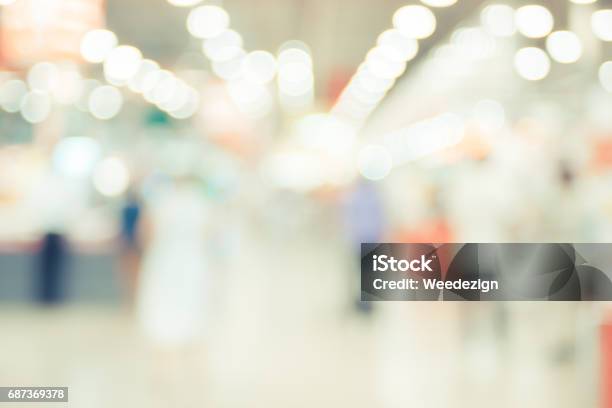 Blurred Background Customer Shopping At Supermarket Store With Bokeh Light Stock Photo - Download Image Now