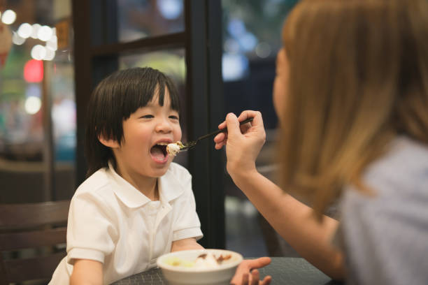 istock Mother and child eating ice cream 687371558